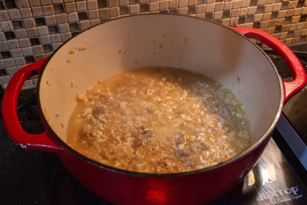 Deglaze the pan with white wine and stock