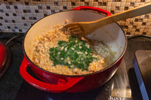 Add frozen spinach to the finished risotto